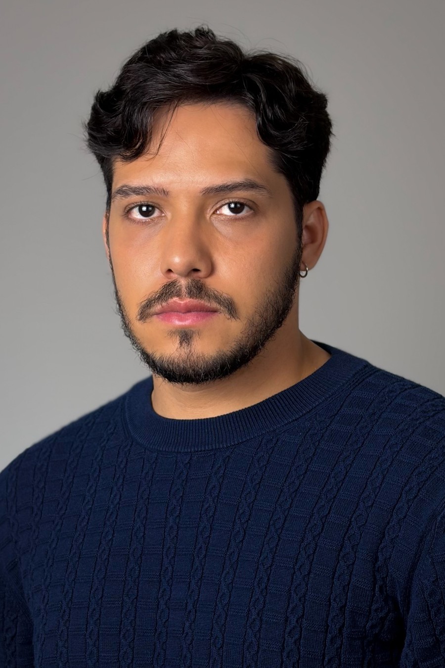 Bruno DiSanto, headshot in a navy sweater